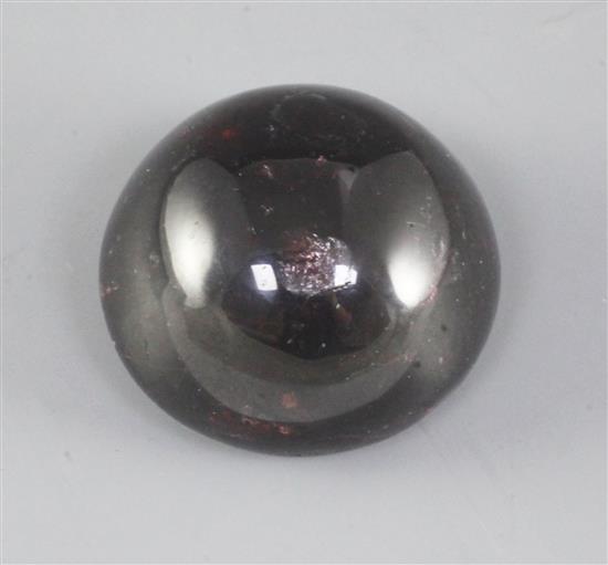 A Chinese red gem stone cabochon shaped scroll weight, diameter 5.1cm